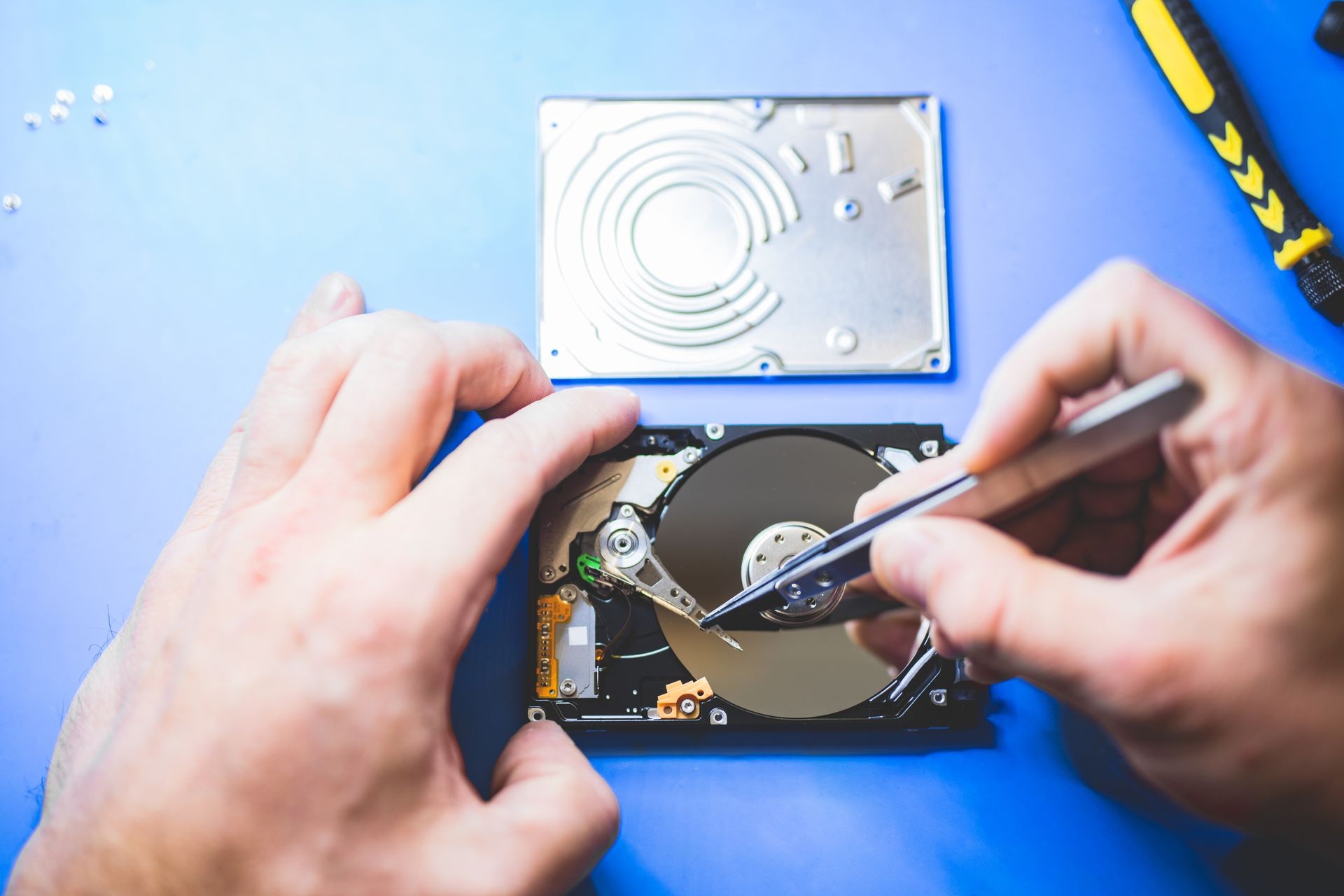 Man fixing a hard disc. IT engineering and hardware. Professional service. Technology.